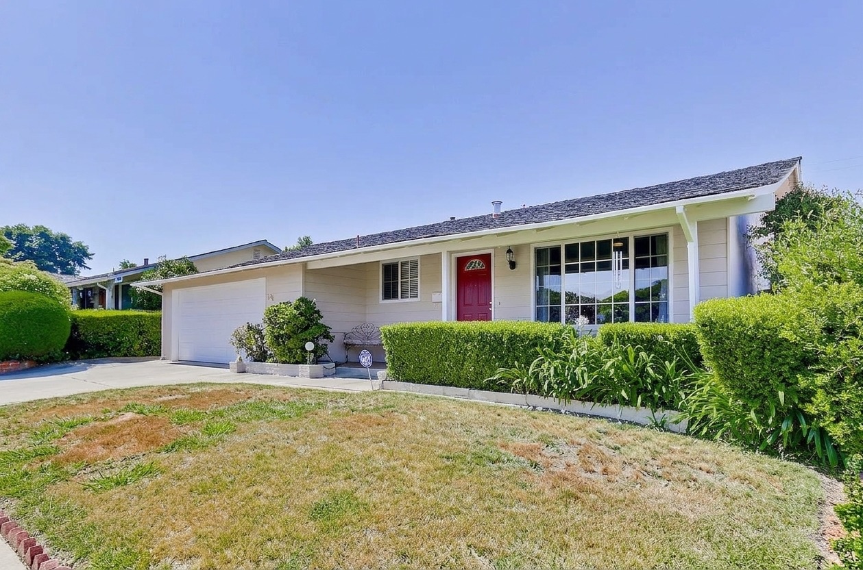 Single-story house with a patchy brown front lawn